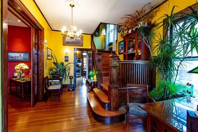 a living room with a couch and some plants at Mike & Allen's Place on the Park_3 in Columbus
