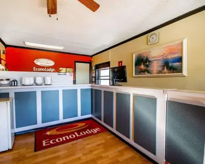 a room with a bar in a restaurant with a counter at ECONO LODGE in Erlanger