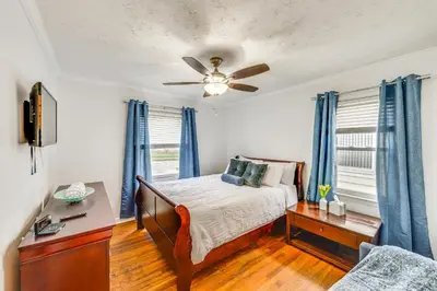 a bedroom with a bed and a ceiling fan at The Maple Tree Home 14 Mi to Downtown Cleveland in Maple Heights