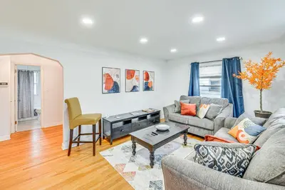 a living room with a couch and a table at The Maple Tree Home 14 Mi to Downtown Cleveland in Maple Heights