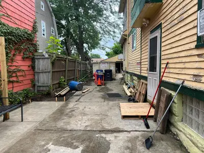 a driveway between two buildings with a house at Stay with Jay - Quinta Suite in Cleveland