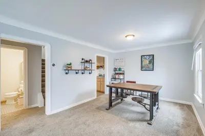 a dining room with a table and a chair at WFH-Friendly Abode with Home Gym in Cleveland in Cleveland