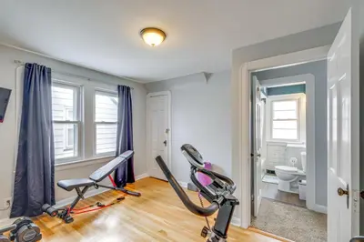 a gym with two exercise bikes and a toilet at WFH-Friendly Abode with Home Gym in Cleveland in Cleveland