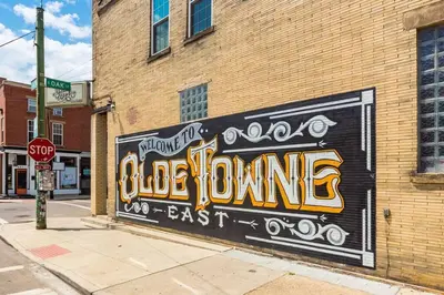 a mural on the side of a brick building at Modern Apartment with Pool Table! Pet-friendly! in Columbus