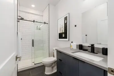 a bathroom with a toilet and a sink and a shower at Designer 1-Bed Haven near Downtown! Pets Welcome! in Columbus