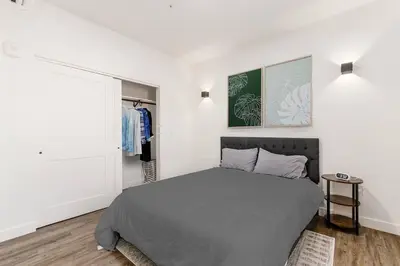 a bedroom with a large bed and a window at Trendy Loft Escape with Pool Table Bring Your Pets in Columbus