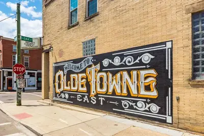 a mural on the side of a brick building at Trendy Loft Escape with Pool Table Bring Your Pets in Columbus