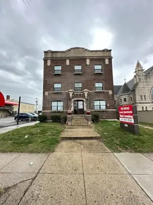 a large brick building with a sign in front of it at Trendy Loft Escape with Pool Table Bring Your Pets in Columbus