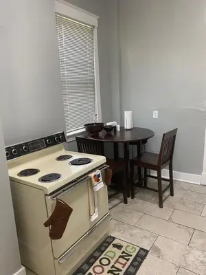 a kitchen with a stove and a small table at Walnut Hills Studio/ Private room in Cincinnati
