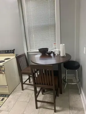 a kitchen with a table and two chairs and a table at Walnut Hills Studio/ Private room in Cincinnati
