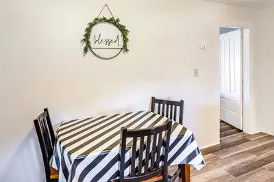 a dining room table with a black and white checkered table cloth at Greenwich Countryside Apartment with Shared Yard in Greenwich