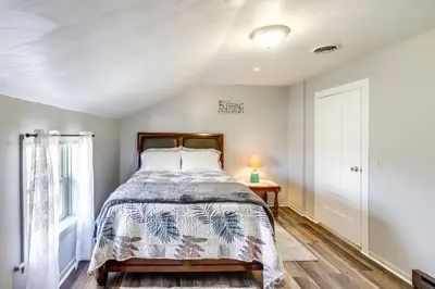 a bedroom with a bed and a window at Greenwich Countryside Apartment with Shared Yard in Greenwich