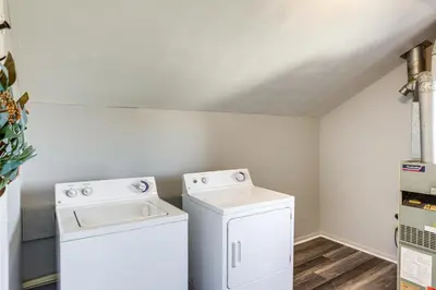 a laundry room with a washer and dryer at Greenwich Countryside Apartment with Shared Yard in Greenwich