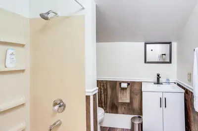 a bathroom with a toilet and a sink at Greenwich Countryside Apartment with Shared Yard in Greenwich