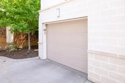a garage door on a white brick building at Luxury Downtown Townhome Unit 14 in Cleveland