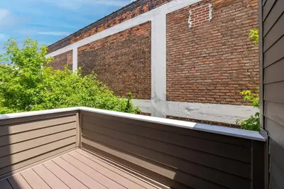 a balcony in front of a brick building at Luxury Downtown Townhome Unit 14 in Cleveland