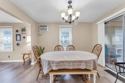a dining room with a table and chairs at Central Falls Hideaway in Cuyahoga Falls
