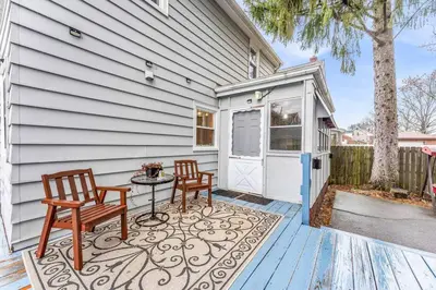 a house with two chairs and a table on a patio at Central Falls Hideaway in Cuyahoga Falls