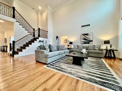 a living room with a couch and a table at NEW, big, beautiful, Executive Home Liberty Twp in Middletown