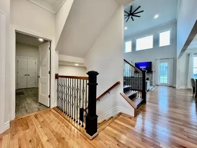 an empty hallway with a staircase in a house at NEW, big, beautiful, Executive Home Liberty Twp in Middletown