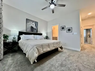 a bedroom with a bed and a ceiling fan at NEW, big, beautiful, Executive Home Liberty Twp in Middletown