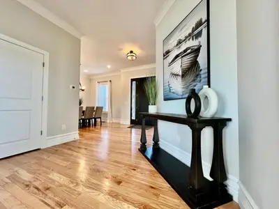 a living room with a table and a painting on the wall at Luxury Home Incredible master suite Liberty Twp OH in Middletown