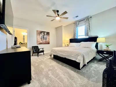 a bedroom with a bed and a ceiling fan at Luxury Home Incredible master suite Liberty Twp OH in Middletown