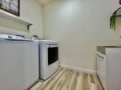 a kitchen with a stove and a dishwasher at Beautiful NEW Ranch Home with a large deck and games in Maud