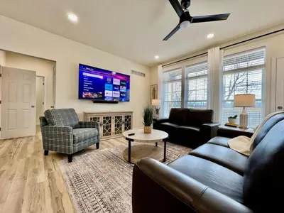 a living room with a couch and a tv at Beautiful NEW Ranch Home with a large deck and games in Maud