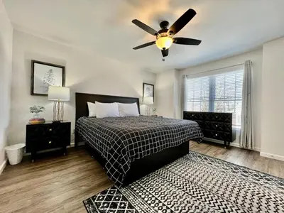a bedroom with a bed and a ceiling fan at Brand new, hidden Pearl of a home Batesville, IN in Batesville