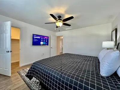 a bedroom with a bed and a ceiling fan at Brand new, hidden Pearl of a home Batesville, IN in Batesville