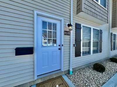 a blue door on the side of a house at Brand new, hidden Pearl of a home Batesville, IN in Batesville