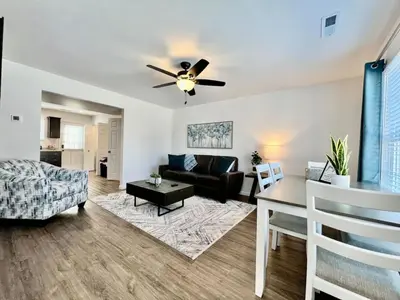a living room with a ceiling fan and a couch at Brand new, hidden Pearl of a home Batesville, IN in Batesville