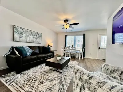 a living room with a couch and a table at Brand new, hidden Pearl of a home Batesville, IN in Batesville