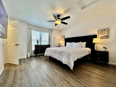 a bedroom with a bed and a ceiling fan at Pearl of a new construction home Batesville, IN in Batesville