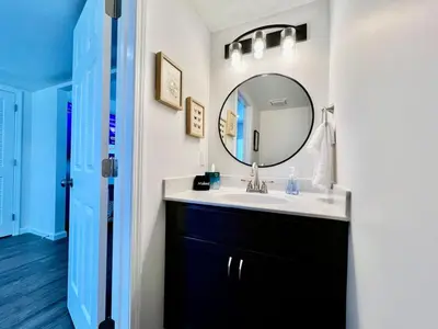 a bathroom with a sink and a mirror at Pearl of a new construction home Batesville, IN in Batesville