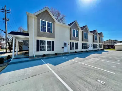 a parking lot in front of a building at Pearl of a new construction home Batesville, IN in Batesville
