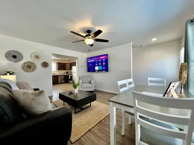 a living room with a ceiling fan and a table at Pearl of a new construction home Batesville, IN in Batesville