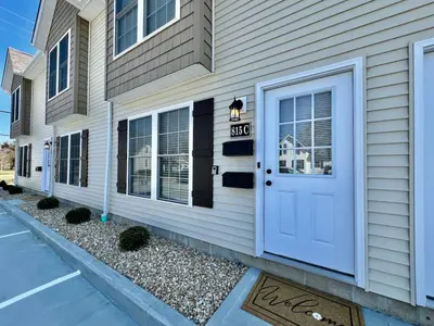 a house with a white door and a sign on it at Pearl of a new construction home Batesville, IN in Batesville