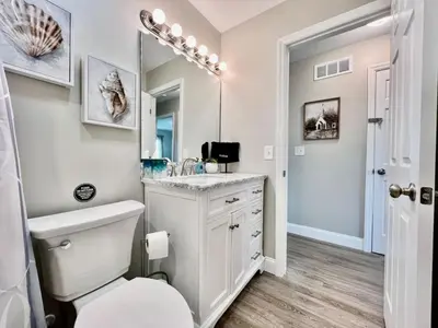 a bathroom with a sink and a toilet and a mirror at New remodel exquisite master suite Trenton, Ohio in Trenton
