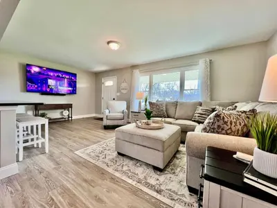 a living room with a couch and a tv at New remodel exquisite master suite Trenton, Ohio in Trenton