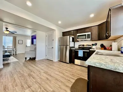 a kitchen with stainless steel appliances and wooden cabinets at Pearl of a home, central Batesville, IN -New build in Batesville