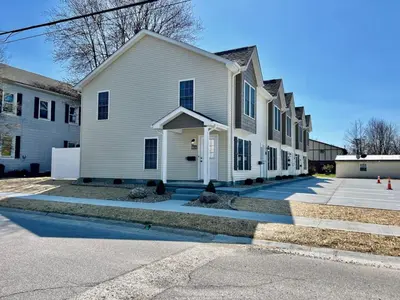 a white house with a driveway in front at Pearl of a home, central Batesville, IN -New build in Batesville