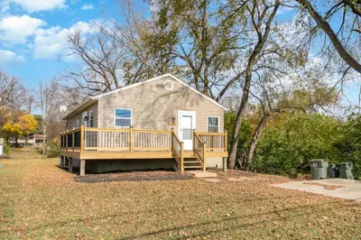 a house with a large porch and a deck at Furnished Ranch Home with FREE washer and dryer in Middletown