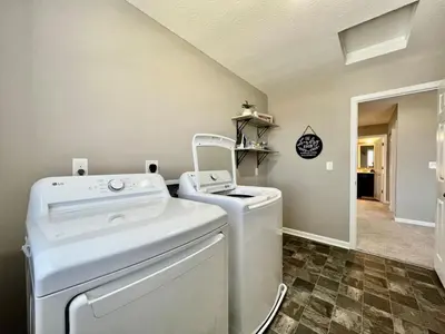 a laundry room with a washer and dryer at Brand new Executive home in Liberty Twp, Ohio in Maustown