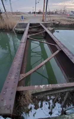 a bridge over a body of water at Part of Mini-Mansion, private, 3 story Lake Erie views in Luna Pier