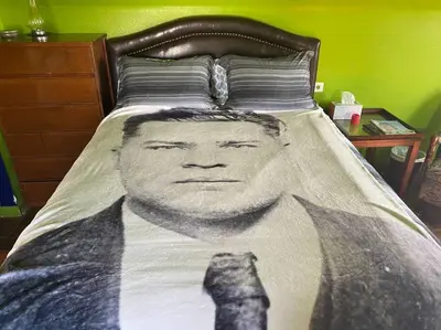 a black and white photo of a man on a bed at Actual Pretty Boy Floyd's Hideout - Lake Erie, MI in Luna Pier