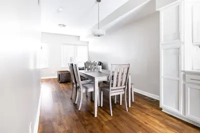 a dining room with a table and chairs at Luxury Downtown Townhome Unit 7 in Cleveland