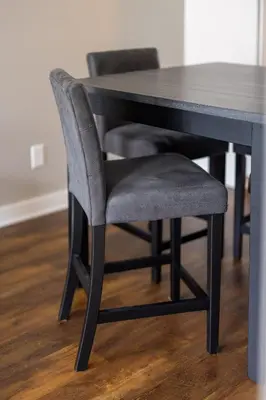 a black dining room table with a gray chair at Luxury Downtown Townhome Unit 5 in Cleveland