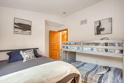 a bedroom with two beds and a bunk bed at Waterfront Buckeye Lake House Deck and Views! in Hebron